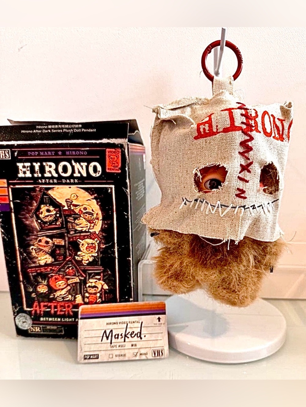 Hirono After Dark Series “Masked” Plush Pendant (2026).